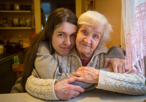 An,Elderly,Woman,In,An,Embrace,With,An,Adult,Granddaughter